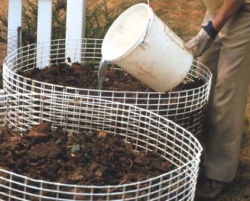 Person Adding Water to the Compost